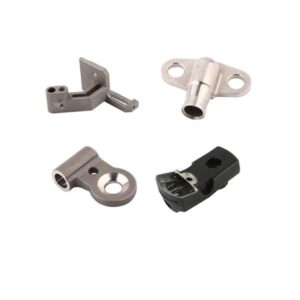 Four small, uniquely shaped metal parts with holes and cutouts on a plain white background.