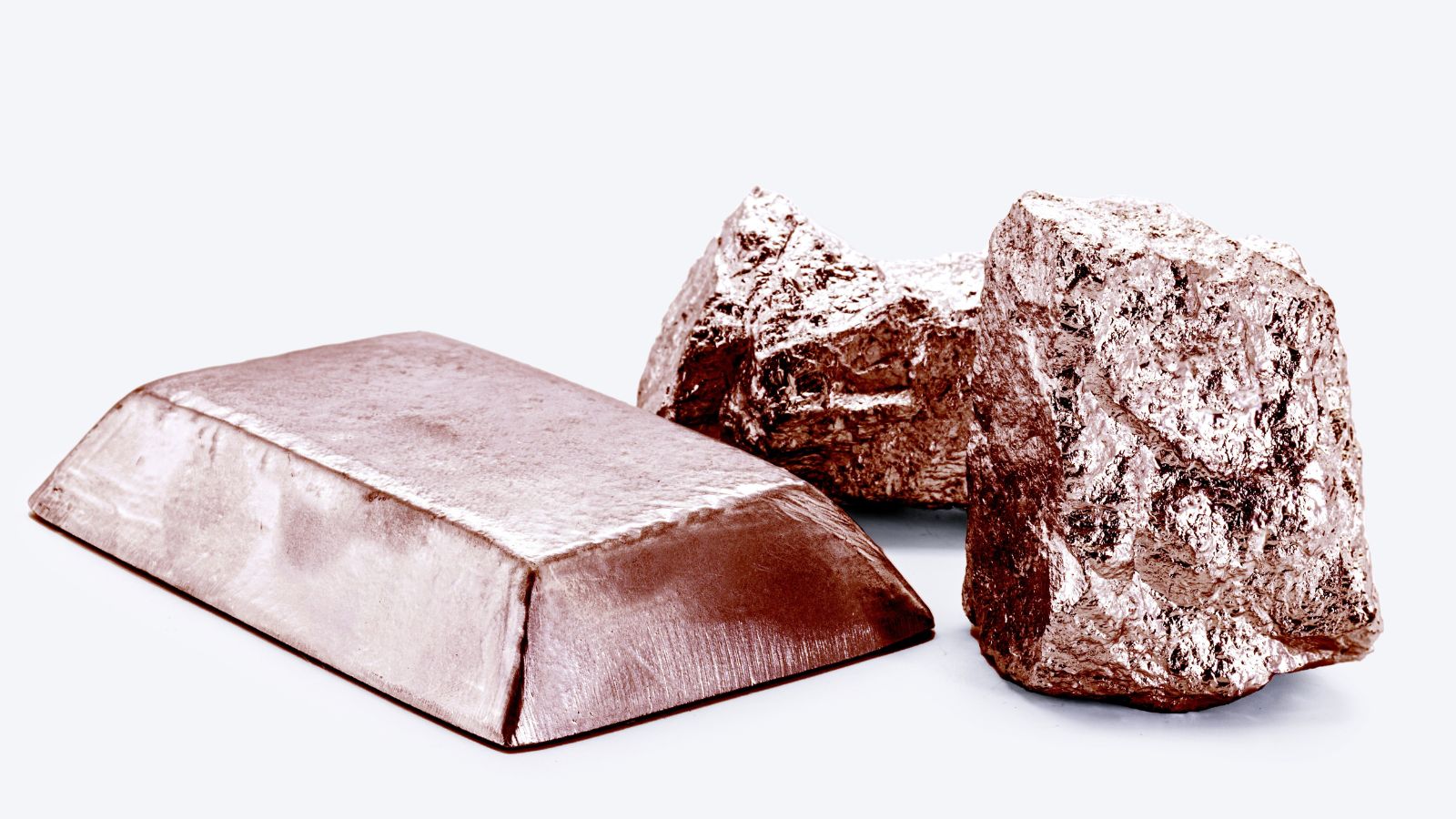 Close-up of copper ingot and raw metal chunk for comparison between copper and brass die casting