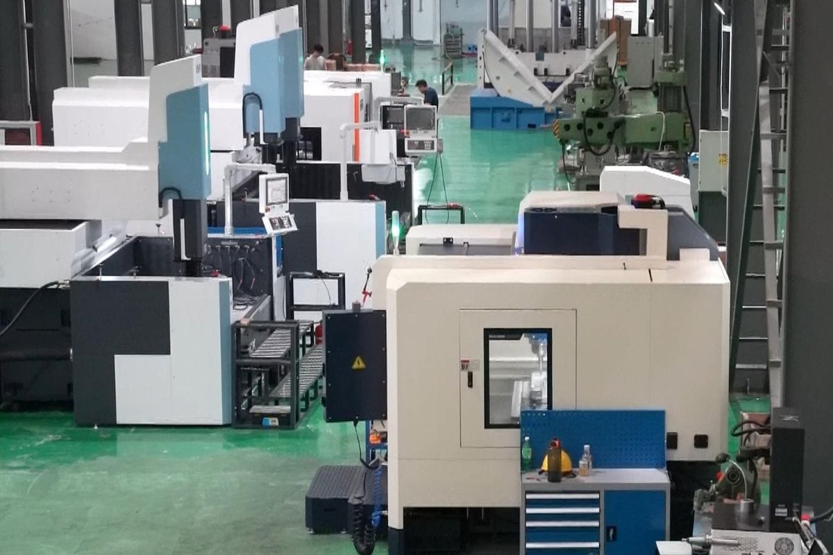 High-tech mold casting machinery in a clean, organized factory setting, showcasing advanced manufacturing technology for precision metal casting.
