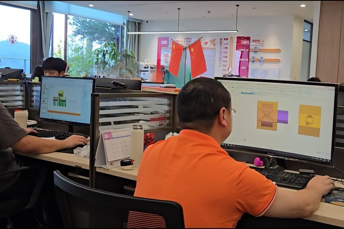 Office workspace at Moldie with employees working on computers, showcasing a modern, collaborative environment for casting design.