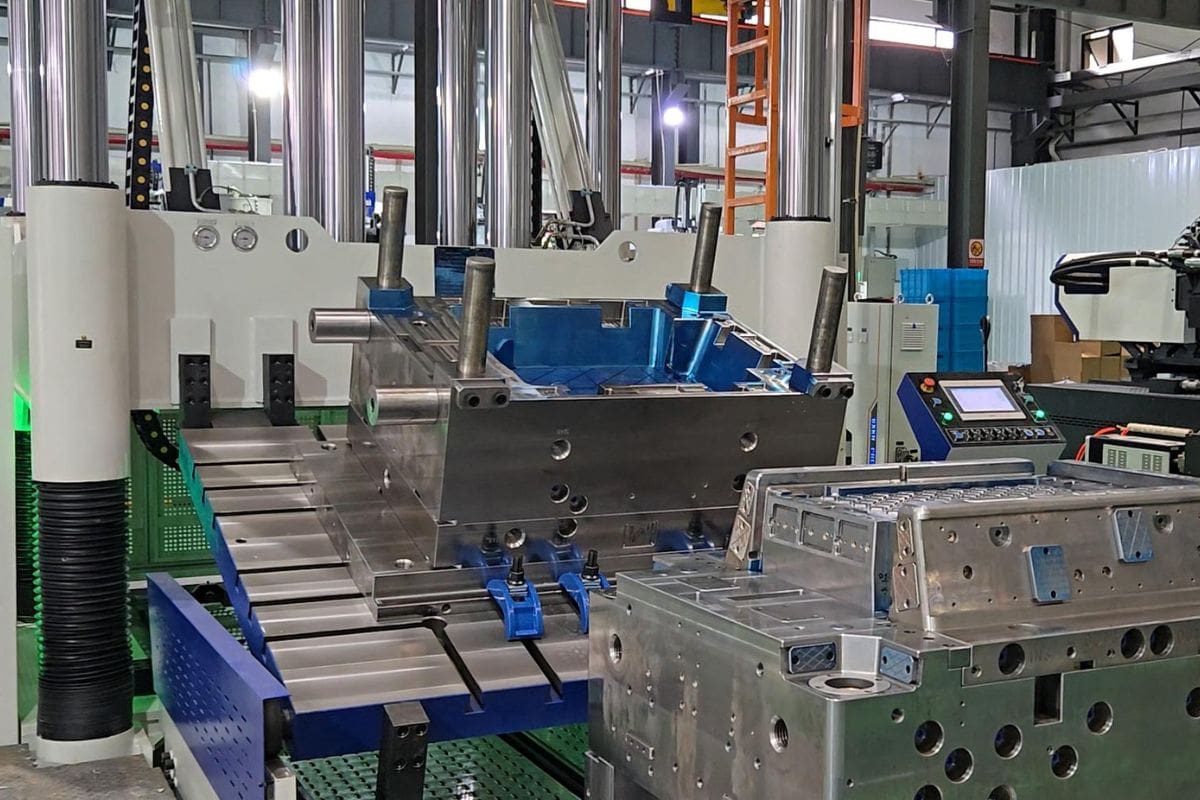 High-precision industrial mold casting machine in a manufacturing facility, showcasing advanced automation and metalworking technology.